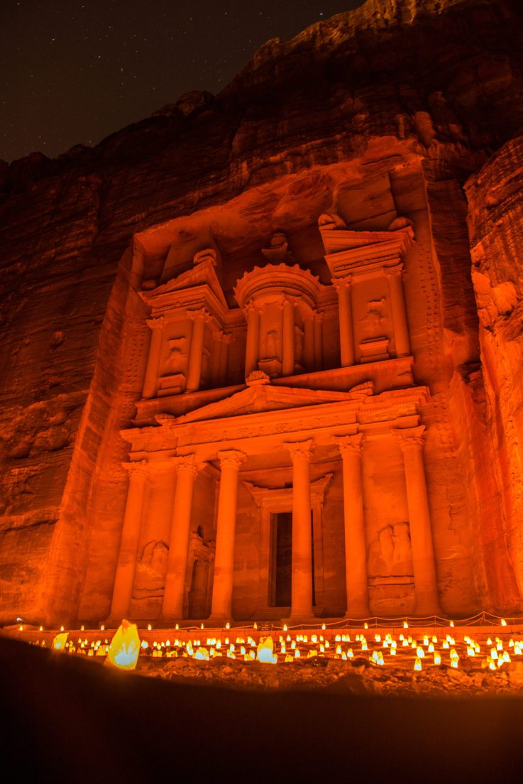 Petra by night, Jordan. The symbol of Petra, the Treasury and the Siq canyon illuminated by candle lights